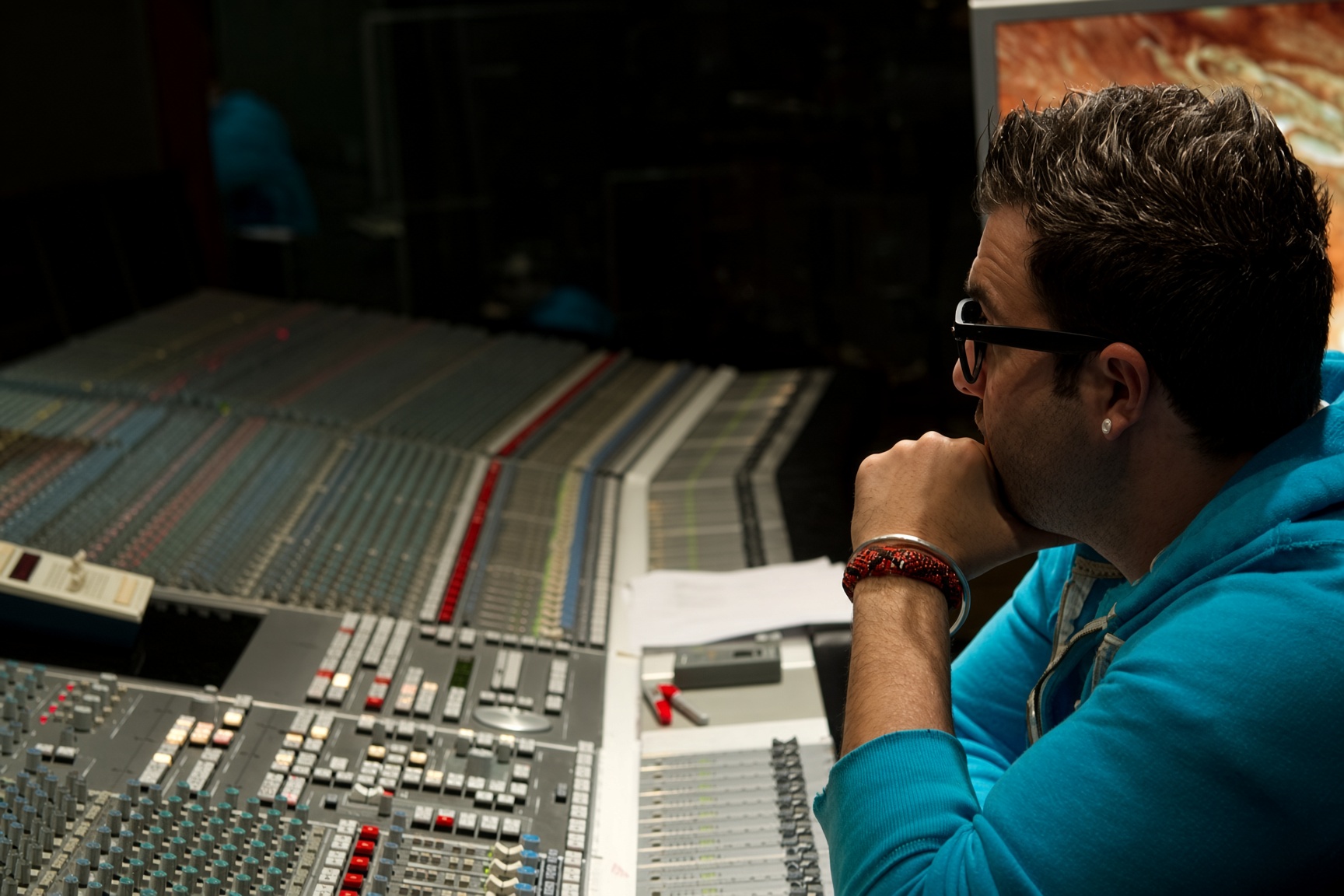 Juan Mario listening at the mixing console