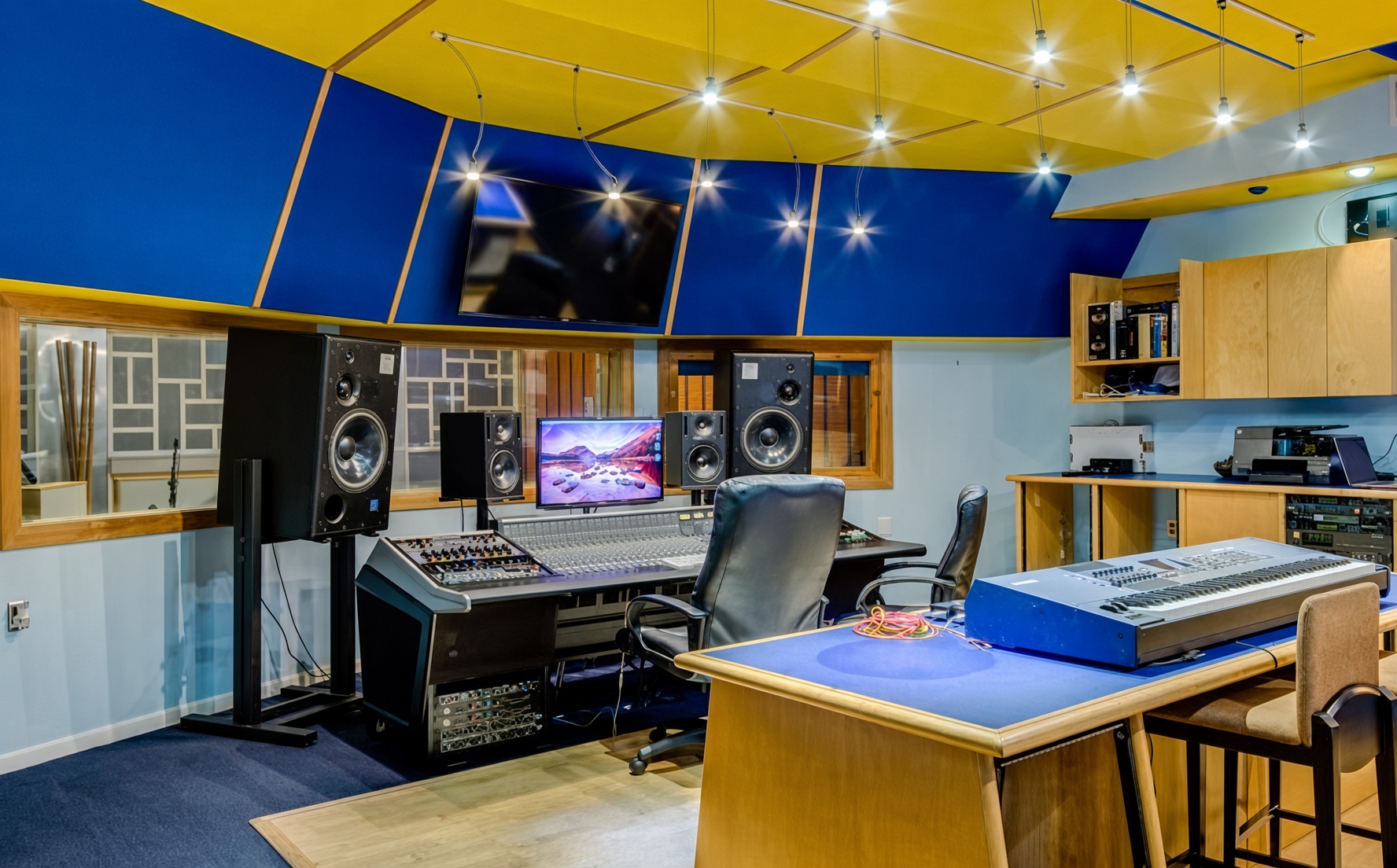 GML Recording Studio control room with mixing console and monitors